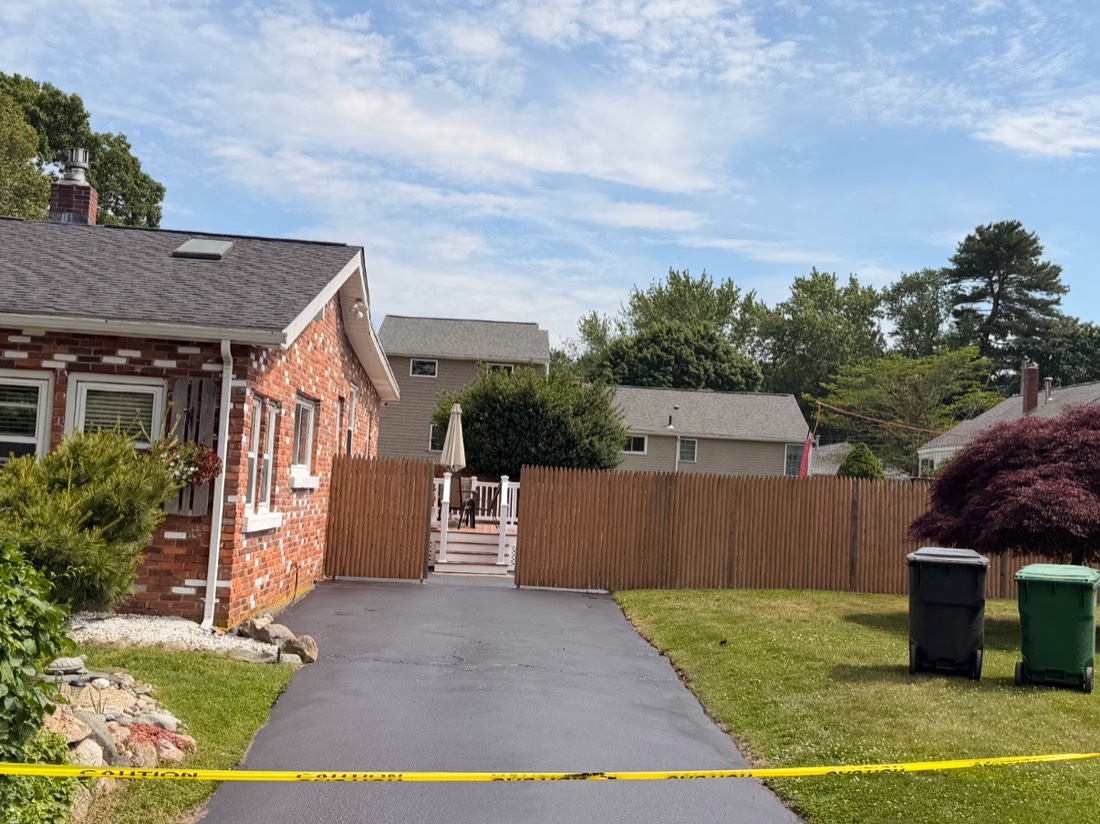 Residential driveway sealcoating