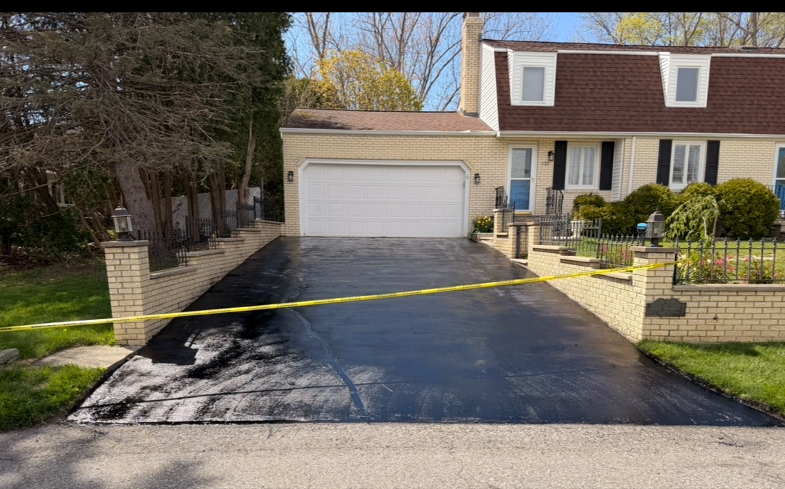 Sealcoated driveway with brick columns